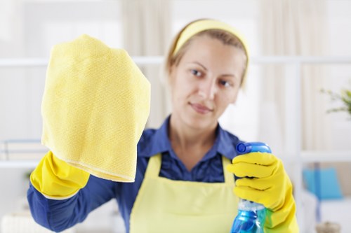 Cleaner in Finsburypark preparing a safe cleaning job with protective equipment
